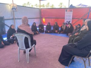 Un grupo de mulleres nunha xuntanza en Palestina